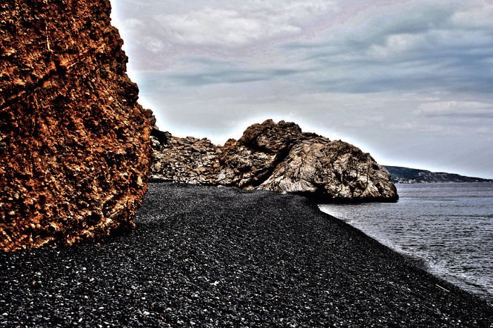 Mavra Volia (černá Pebble Beach), Chios Island, Řecko Mavra Volia (černá Pebble Beach), Chios Island, Řecko